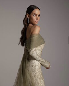 Woman in lace green and white dress